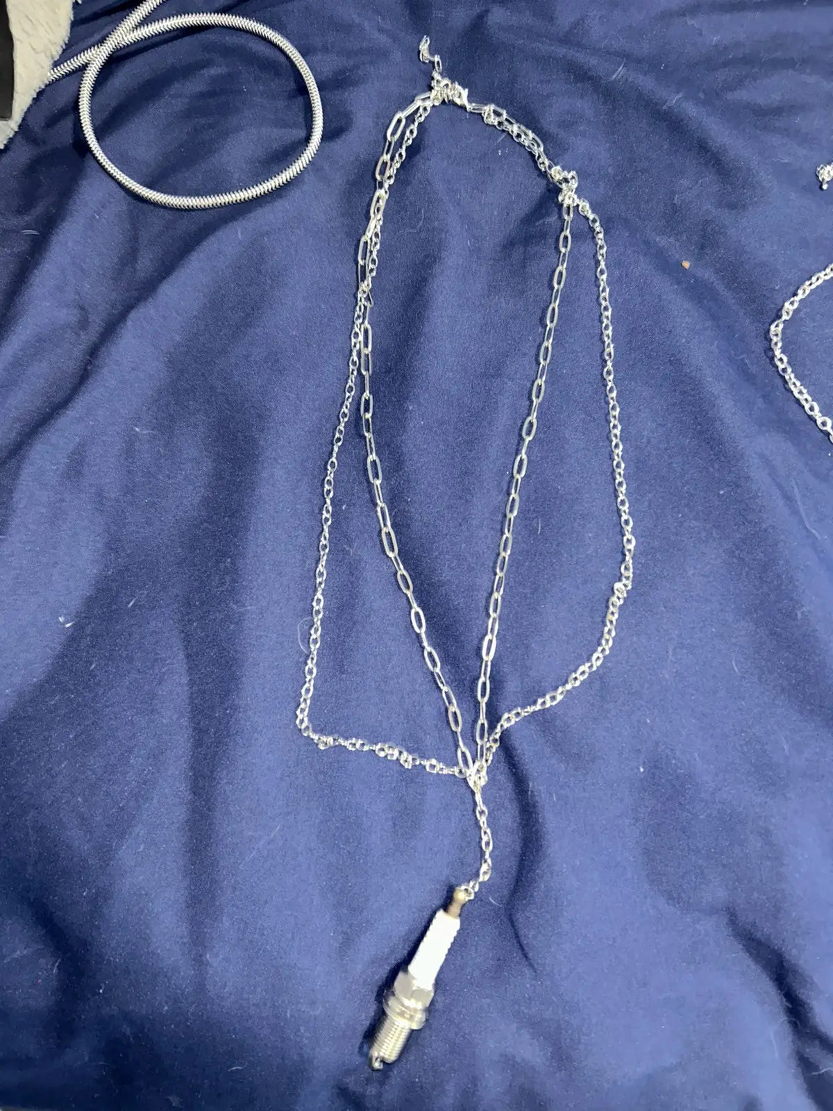 Layered spark plug necklace
