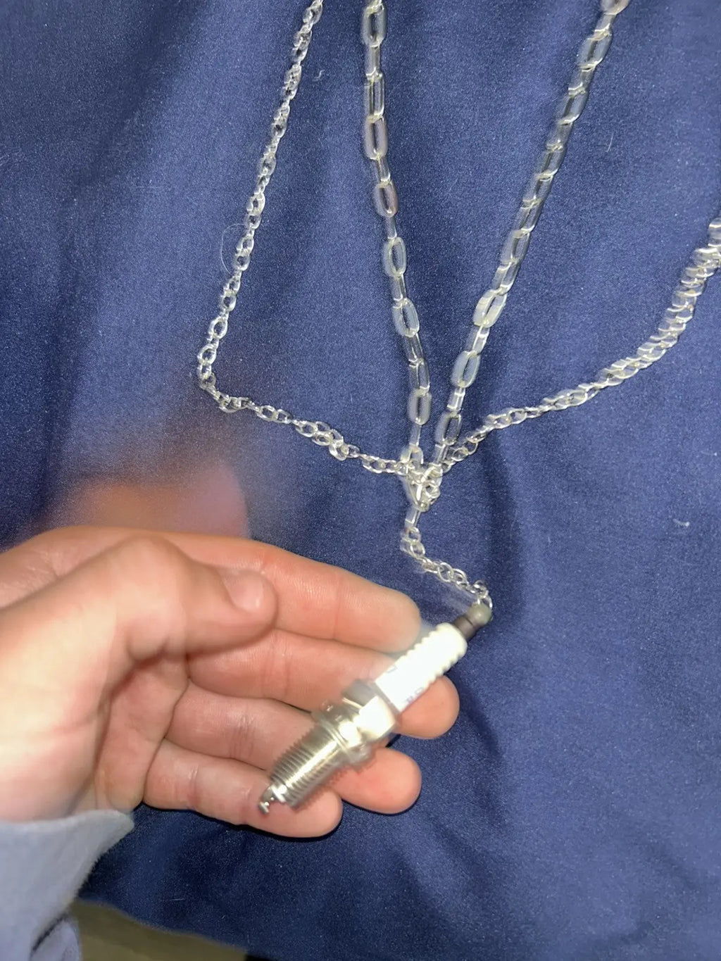 Layered spark plug necklace