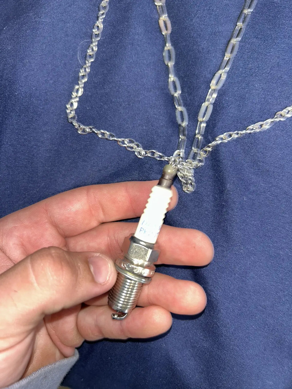 Layered spark plug necklace